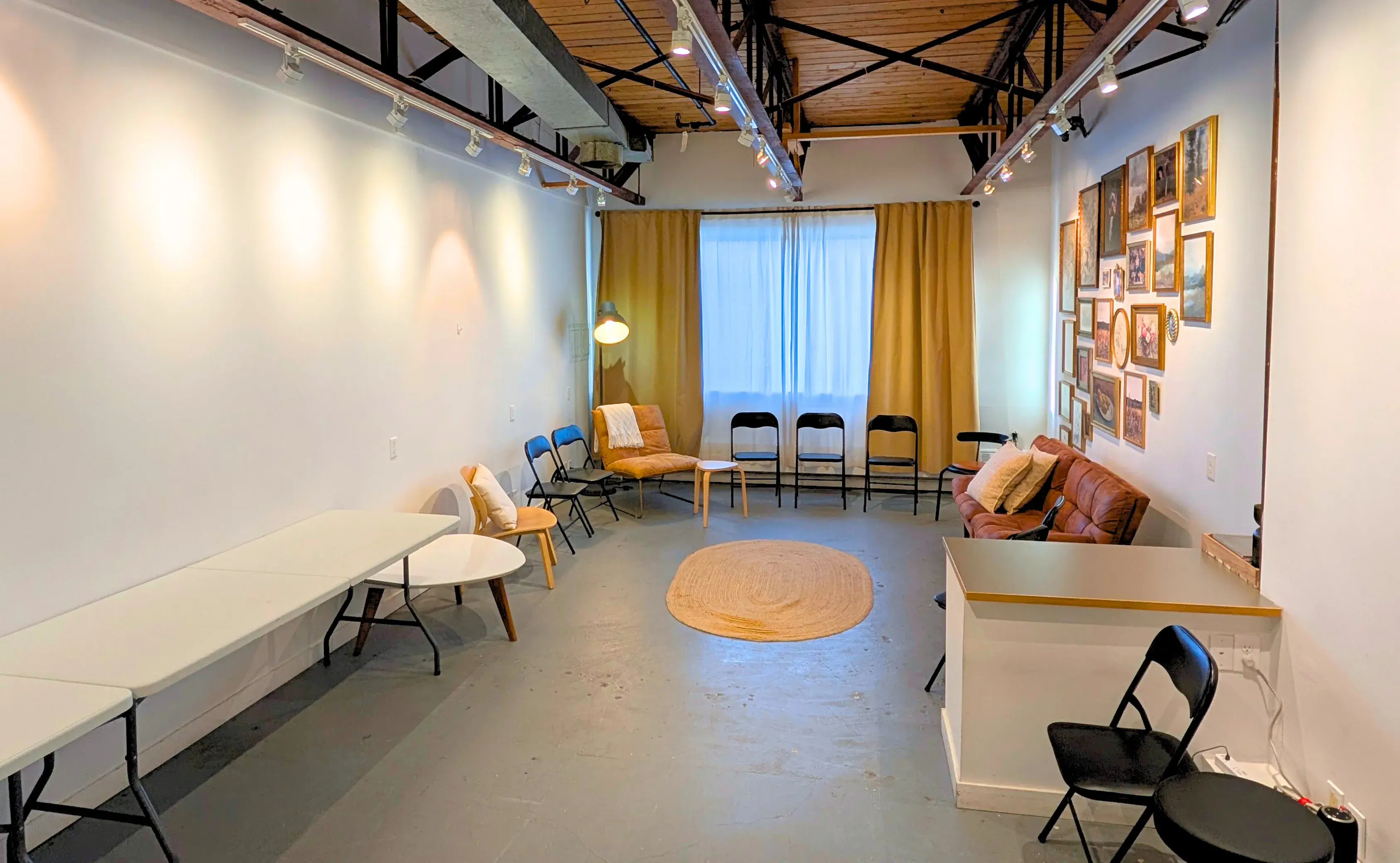Open floor layout with seating around the edges